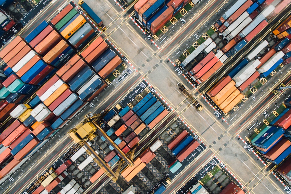 An aerial view of shipping containers that have arrived at port. An International Trade program will set you on an exciting career path that could involve many of these shipping containers.